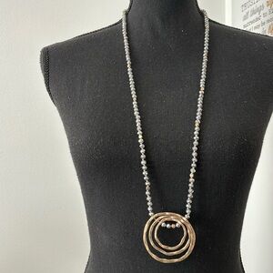 Gray beaded necklace with gold accent